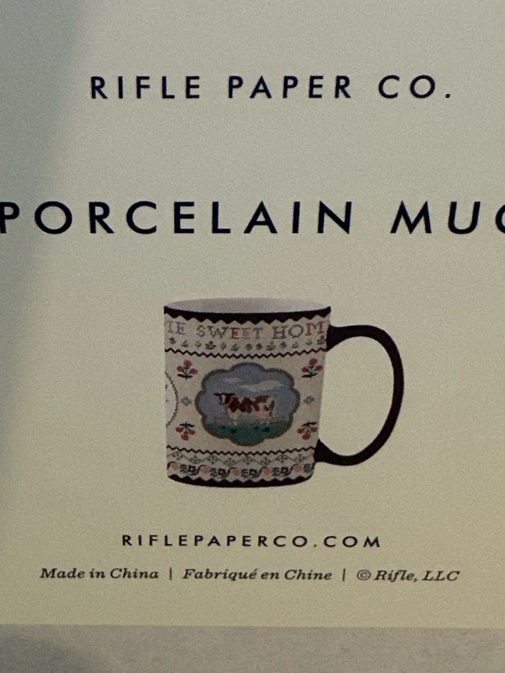 Rifle Paper Co. Cream Mug with Red Handle and Floral Cow Design - Picture 5 of 6